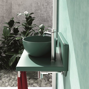 Lille håndvask med bordplade i mørkegrøn porcelæn